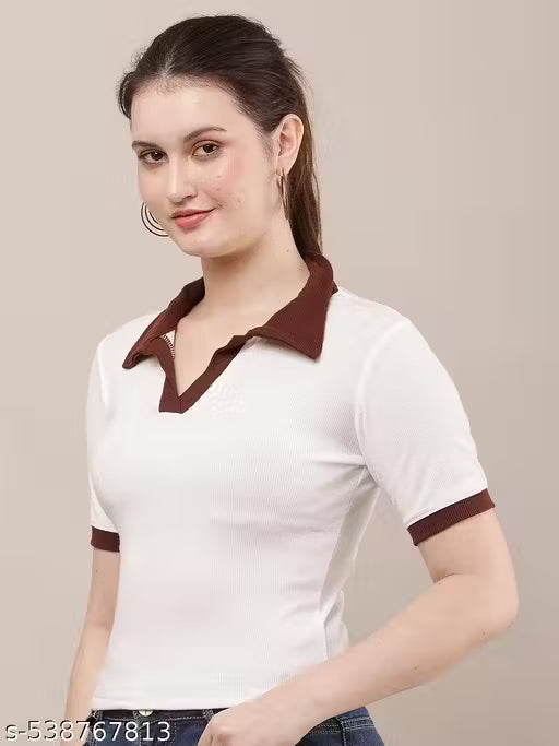 Woman wearing a white polo shirt with brown accents on a beige background